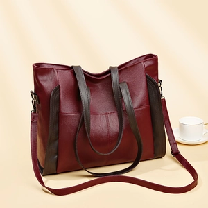 Large burgundy soft leather tote bag for women with contrast shoulder straps and elegant shadows