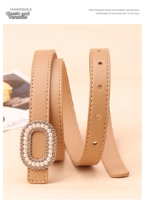 Detail of elegant khaki leather belt featuring an oval buckle with pearls and rhinestones