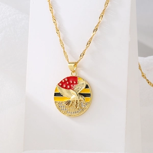 Gold plated necklace with eagle pendant featuring red enamel and zircon micro-inlay