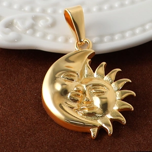 Macro shot of 24K gold plated stainless steel sun and moon face pendant detail