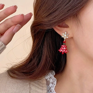 Festive silver needle earrings with rhinestone snowflake and red Christmas tree pendants