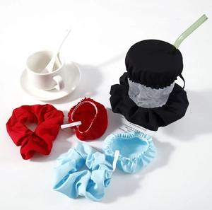 Detail of fabric drink covers in red, black and blue with matching hair scrunchies