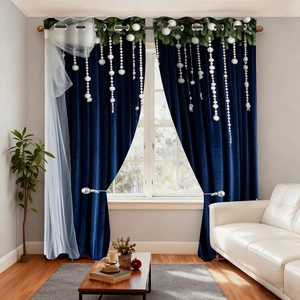 Detail of dark blue velvet Christmas curtains with evergreen leaf print and white bead trim