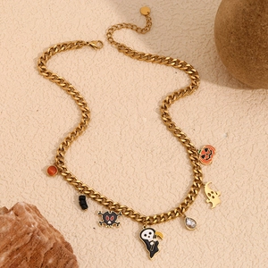 Close-up of 18K gold plated Cuban chain with Halloween ghost and pumpkin charms