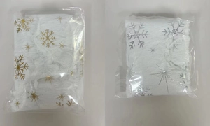 Packaged mini plush Christmas tree skirts featuring gold and silver snowflake patterns
