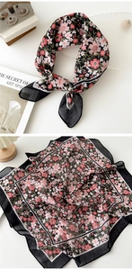 Detail of floral square scarf with pink blooms and delicate black border design