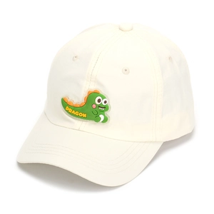 Detail of cute green dragon patch and embroidered Dragon text on beige kids baseball cap