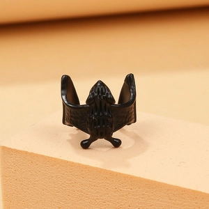 Dark style black bat ring with detailed texture for men and women on orange display