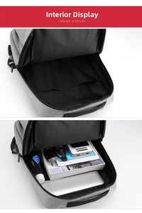 Detailed interior of grey business backpack showing multi-pocket storage for laptop and gear
