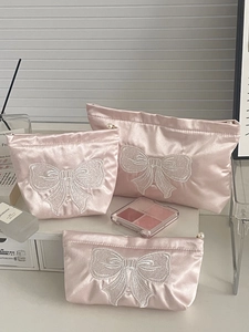 Pink satin cosmetic bag set with embroidered bows and elegant pearl zippers