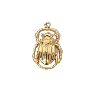 Macro shot of 14k gold plated stainless steel scarab pendant with polished details