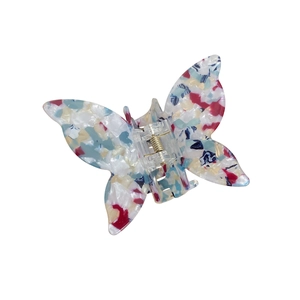 Colorful acetate butterfly hair claw clip with vibrant terrazzo pattern on white background