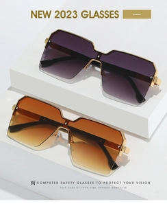 Detail of square oversized rimless sunglasses with metal temples and gradient lenses