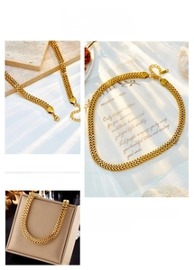 Detail of gold layered herringbone snake chain necklace with lobster clasp and extender