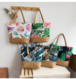 Detail of canvas tote bags with jute bottoms showing ocean life and tropical plant patterns