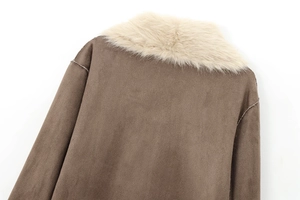 Detail of dark brown faux suede coat featuring a thick off-white faux fur collar