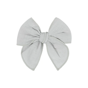 Classic light grey cotton linen fabric bow hair clip for children on white background