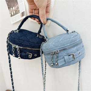 Mini denim quilted crossbody bags in light and dark blue with chain straps and top handles