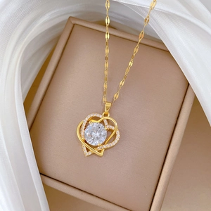 Double heart gold necklace with large round zircon in a beige jewelry gift box