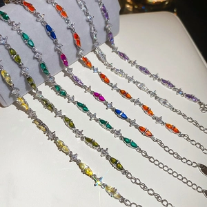 Detail of teardrop zircon bracelets in multiple colors with shining metal finish
