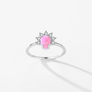 Elegant S925 sterling silver ring with pink pear-cut opal and crown-set cubic zirconia