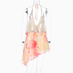 Detail of pink and yellow gradient hibiscus floral dress with back tie and asymmetrical hem