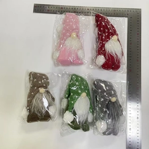 Detailed size measurement of five colorful Christmas forest gnomes in plastic packaging