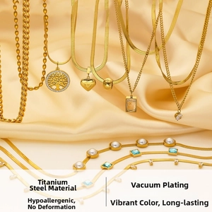 Macro shot of gold titanium steel tree of life necklace with vacuum plating details