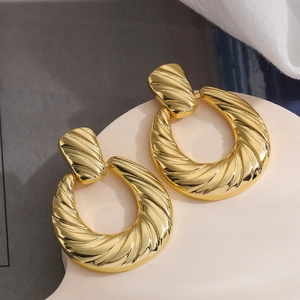 Vintage geometric gold-plated hoop earrings with textured spiral design for women