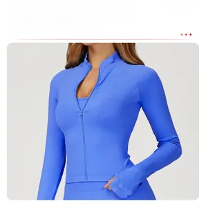 Detail of bright blue yoga jacket featuring a stand-up collar and full zipper closure