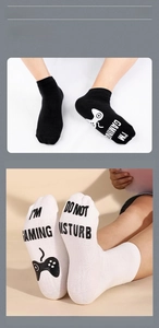 Close-up of anti-slip game controller icons and I'M GAMING text on cotton socks