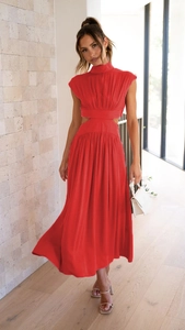 Detail of red sleeveless midi dress featuring high neck and stylish waist cut-outs