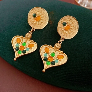 Vintage gold tassel earrings with colorful gemstones and floral heart pendant design