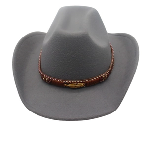Detail of grey wool felt cowboy hat featuring a braided brown band and gold feather charm