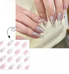Detailed view of coffin nails with silver butterfly patterns and sparkling rhinestones