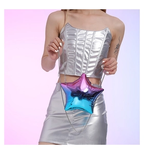 Detailed view of the gradient star-shaped acrylic evening bag with metallic chain strap