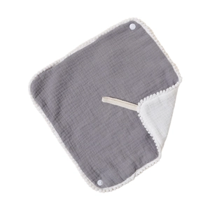 Gray cotton gauze baby bandana bib with white pom-pom trim and snap buttons for infants