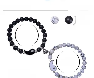 Detail of Yin Yang magnetic couple bracelets with 8mm volcanic stone and white turquoise beads