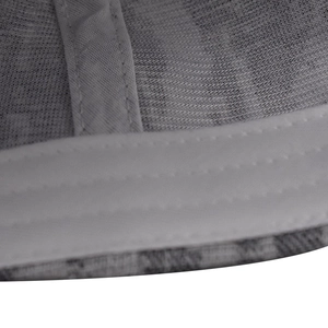 Detailed macro view of the inner sweatband and stitching of the plaid baseball cap
