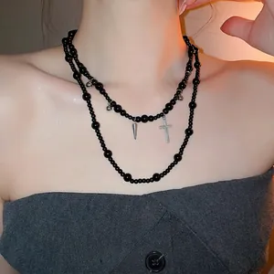 Y2K style double-layered black glass beaded necklace with silver cross pendant