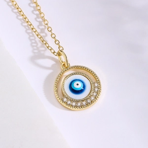 Golden Evil Eye pendant necklace with blue enamel and sparkling zircon accents