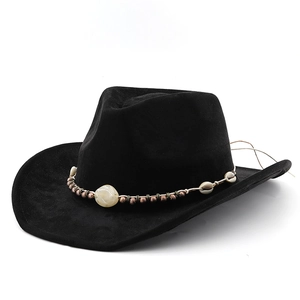 Detail of bohemian black suede cowboy hat featuring ethnic beads and shell headband