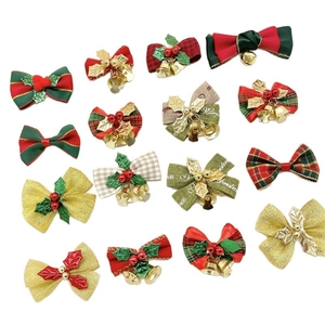 Christmas burlap bow decorations with bells and holly leaves in red, green and gold colors