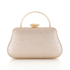 Detailed shot of champagne gold glitter evening bag with round metal handle and clasp