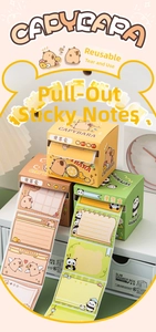 Detail of pull-out cartoon sticky notes with cute capybara and panda dispenser designs