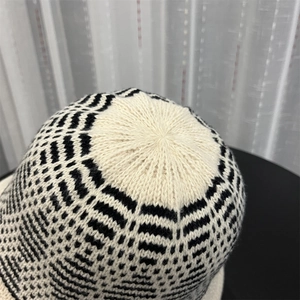 Close-up of the crown stitching on a mixed-color jacquard knit bucket hat for women
