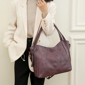 Chic purple-red PU leather tote bag with diamond texture and elegant tassel detail