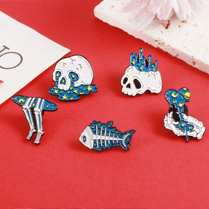 Five-piece gothic celestial enamel pins set featuring starry skulls and skeletal hands