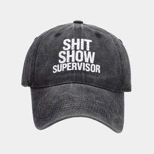 Charcoal grey washed cotton baseball cap with Shit Show Supervisor vintage white print