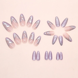 Detail of almond-shaped purple glitter fake nails with metallic fluid patterns